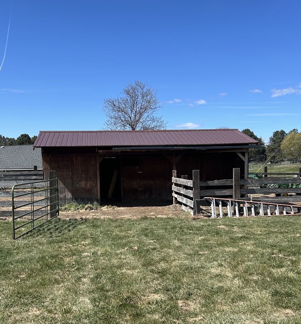 MCM customer build — weathered copper siding with dark brown wainscot